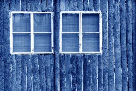 windows on the brown wooden wall in a park, chinaの写真素材