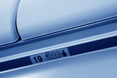 Boeing 737 airliner cabin luggage, closeup of pictures