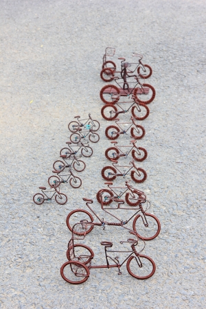 toy crafts bicycle made of copper wire on the groundの写真素材