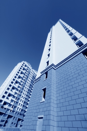 unfinished color building, under the blu sky backgroundの写真素材