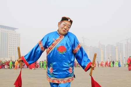 LUANNAN COUNTY - FEBRUARY 27  During the Chinese Lunar New Year, people wear colorful clothes, yangko dance performances in the streets, on February 27, 2013, Luannan County, Hebei Province, China のeditorial素材