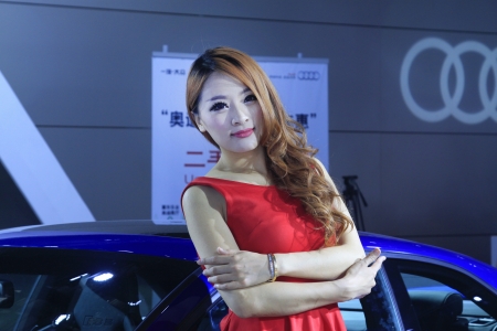 TANGSHAN - JUNE 2  Beautiful female model in an automobile exhibition on June 2, 2013,Tangshan, Hebei Province, China のeditorial素材