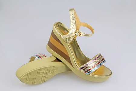 beautiful Women's high-heeled color sandals on a white backgroundの写真素材