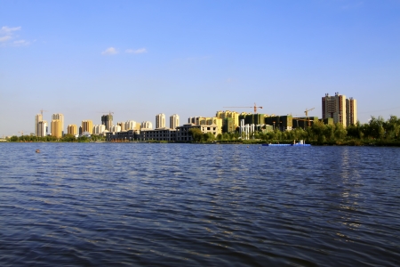 LUANNAN COUNTY - AUGUST 30: The High-rise buildings standing at the water's edge in the North River Park, on August 30, 2013, LuanNan county, hebei province, China. 
のeditorial素材