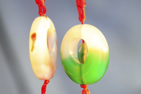 fine jade pendant in a shop, closeup of photoの写真素材