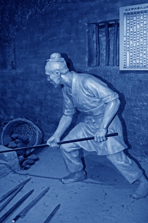 TANGSHAN - OCTOBER 18: The han dynasty iron smelting sculpture in kailuan museum on october 18, 2013, tangshan city, hebei province, China. 
のeditorial素材