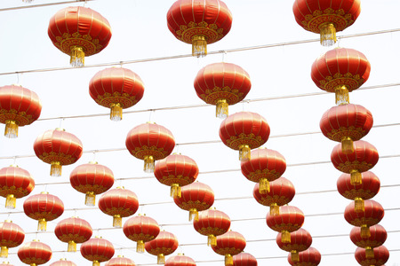 red lanterns in the sky, closeup of photoの写真素材