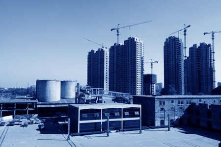TANGSHAN - NOVEMBER 4: The old buildings and new buildings in the Qixin cement plant on november 4,...