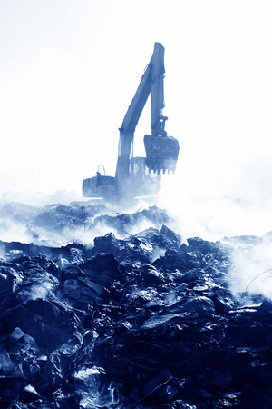 TANGSHAN - NOVEMBER 20: The excavators were clearing up rubbish after fire, November 20, 2013, tangshan city, hebei province, China. のeditorial素材