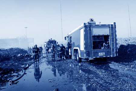 TANGSHAN - NOVEMBER 20: The prepare to leave the scene of the fire fighting vehicles and personnel...