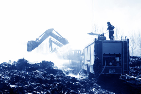 TANGSHAN - NOVEMBER 20: firefighters in sprinkler at the scene of the fire, November 20, 2013,...