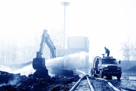 TANGSHAN - NOVEMBER 20: firefighters in sprinkler at the scene of the fire, November 20, 2013, tangshan city, hebei province, China. 
のeditorial素材
