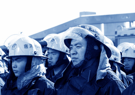 TANGSHAN - NOVEMBER 20: The firemen preparing to leave the fire scene after the fire, November 20, 2013, tangshan city, hebei province, China. 
のeditorial素材