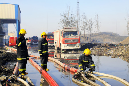 TANGSHAN - NOVEMBER 20: The firemen were control remote water supply pipeline in the scene of fire...