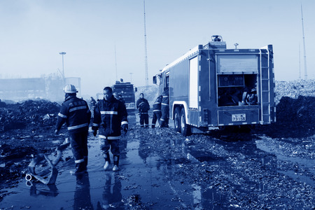 TANGSHAN - NOVEMBER 20: The prepare to leave the scene of the fire fighting vehicles and personnel after the fire, November 20, 2013, tangshan city, hebei province, China. のeditorial素材