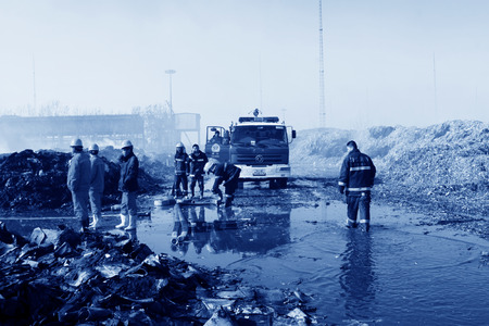 TANGSHAN - NOVEMBER 20: The prepare to leave the scene of the fire fighting vehicles and personnel after the fire, November 20, 2013, tangshan city, hebei province, China. のeditorial素材