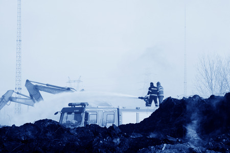TANGSHAN - NOVEMBER 20: firefighters in sprinkler at the scene of the fire, November 20, 2013, tangshan city, hebei province, China. のeditorial素材