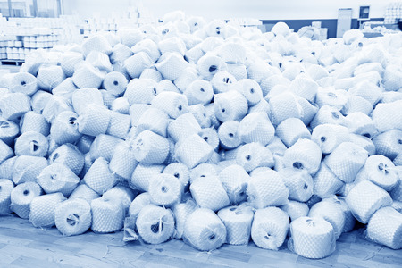 LUANNAN COUNTY - DECEMBER 20: The cotton reel thread piled up together in a production workshop, in the ZeAo spinning LTD., on December 20, 2013, Luannan county, hebei province, China. のeditorial素材