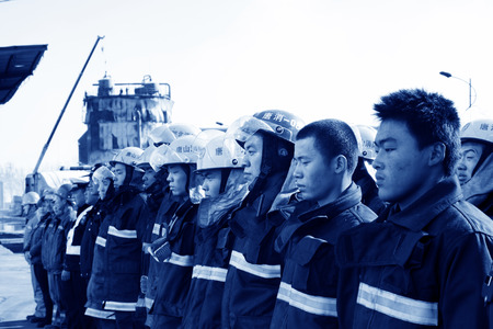 TANGSHAN - NOVEMBER 20: The firemen preparing to leave the fire scene after the fire, November 20, 2013, tangshan city, hebei province, China. のeditorial素材
