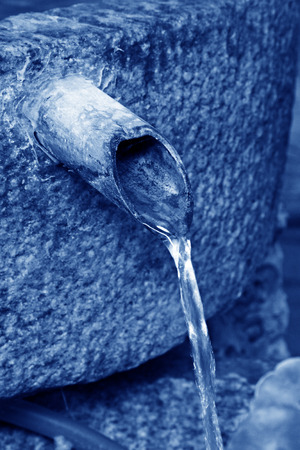 Water and bamboo in a garden, closeup of photoの写真素材