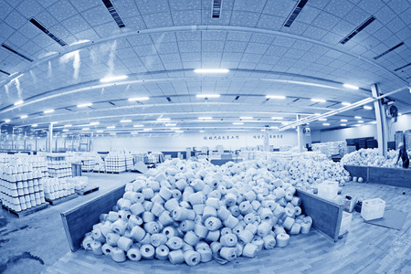 LUANNAN COUNTY - DECEMBER 20: The cotton reel thread piled up together in a production workshop, in the ZeAo spinning LTD., on December 20, 2013, Luannan county, hebei province, China. 
のeditorial素材