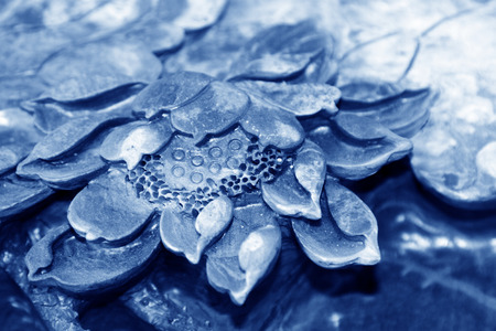 Lotus leaf shape stone carving works, closeup of photoの写真素材