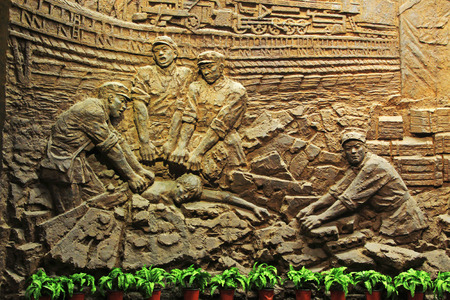 TANGSHAN CITY - NOVEMBER 16: The embossment works on the wall in the Tangshan earthquake ruins park, on november 16, 2013, tangshan city, hebei province, China. 
のeditorial素材