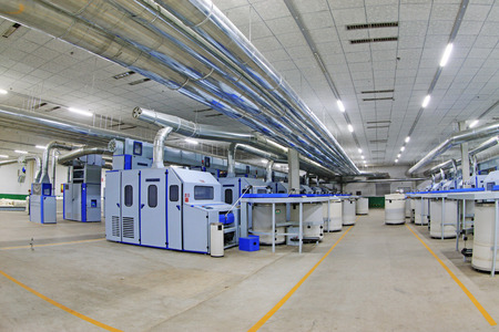 LUANNAN COUNTY - DECEMBER 20: The combed cotton production line and pipes in the ZeAo spinning LTD.,...
