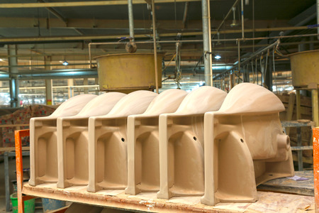 LUANNAN COUNTY - JANUARY 5: The ceramic semi-finished products parts on the iron frame, in the ZhongTong Ceramics Co., Ltd. January 5, 2014, Luannan county, Hebei Province, China.のeditorial素材