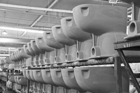 LUANNAN COUNTY - JANUARY 5: The ceramic semi-finished products parts on the iron frame, in the ZhongTong Ceramics Co., Ltd. January 5, 2014, Luannan county, Hebei Province, China.のeditorial素材