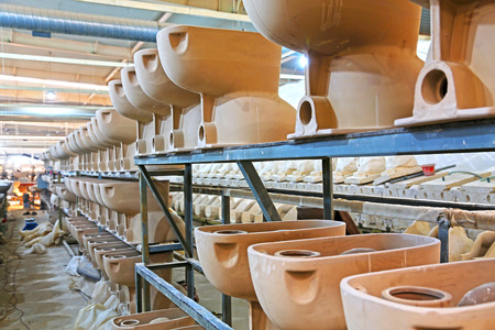 LUANNAN COUNTY - JANUARY 5: The ceramic semi-finished products parts on the iron frame, in the ZhongTong Ceramics Co., Ltd. January 5, 2014, Luannan county, Hebei Province, China.のeditorial素材