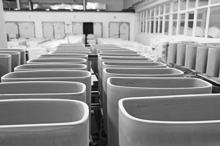 LUANNAN COUNTY - JANUARY 5: The ceramic semi-finished products parts on the iron frame, in the ZhongTong Ceramics Co., Ltd. January 5, 2014, Luannan county, Hebei Province, China.のeditorial素材