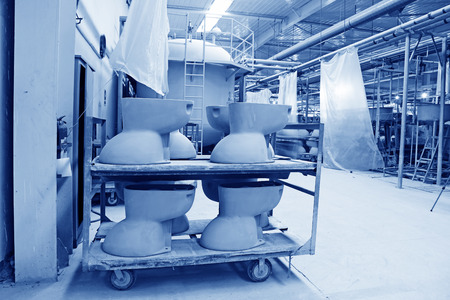 LUANNAN COUNTY - JANUARY 5: The ceramic semi-finished products parts on the iron frame, in the ZhongTong Ceramics Co., Ltd. January 5, 2014, Luannan county, Hebei Province, China.のeditorial素材