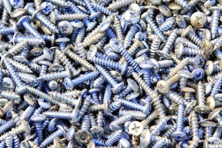 self-tapping screw piled up together, closeup of photoの写真素材