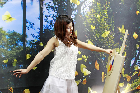 FENGNAN CITY - MARCH 30: A white skirt female model was drawing, March 30, 2014, Fengnan city, hebei province, China. のeditorial素材