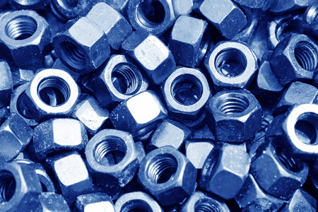 new screw nut piled up together, closeup of photo
