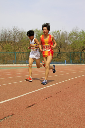 LUANNAN COUNTY - APRIL 10: 3000 m distance runner runing on the playground in a school, on April 10, 2014, Luannan county, hebei province, China. 
のeditorial素材