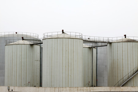 Storage tanks in a production enterprise, closeup of photo