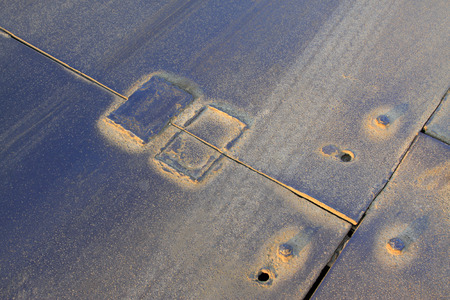 patch on steel plate, closeup of photo