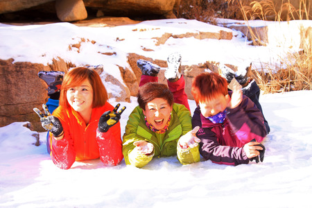 QINGLONG - JANUARY 18: A few ladies on the snow, feeling of an extraordinary experience, on January...