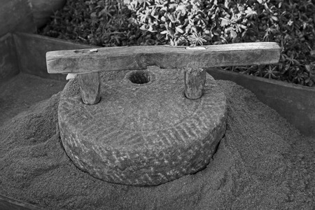 stone mill in a dressing stall, closeup of photoの写真素材