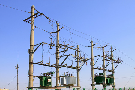 telegraph poles and transformer under sky, closeup of photo