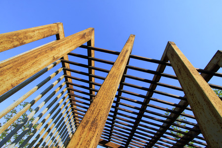 Oxidation rust steel beams in blue sky background, closeup of photoの写真素材
