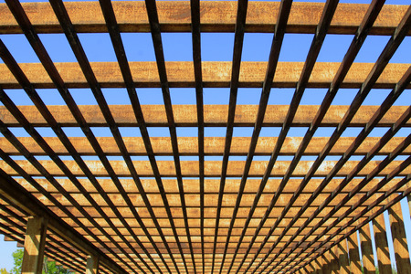Oxidation rust steel beams in blue sky background, closeup of photo