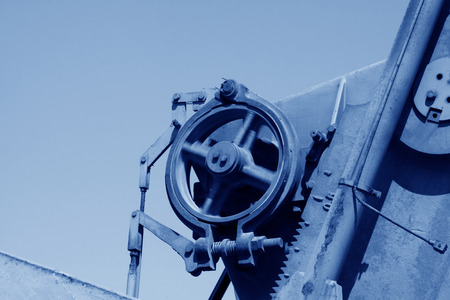 Beam pumping unit rotating wheels, closeup of photoのeditorial素材