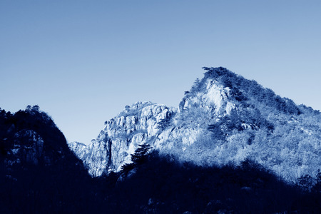 mountains under the blue sky in winter の写真素材