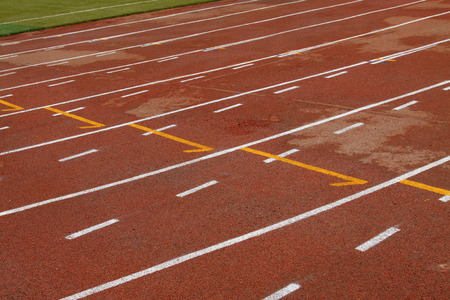 wet red plastic runway in a sports ground in a middle schoolの写真素材