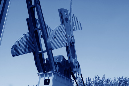 CAOFEIDIAN - MAY 2: crank balanced beam pumping unit in the JiDong oilfield, on may 2, 2014, caofeidian, hebei province, China. のeditorial素材
