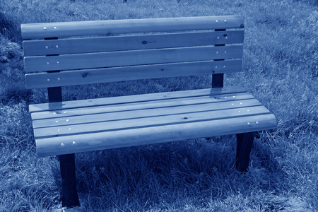 wooden chair in the park, closeup of photoの写真素材