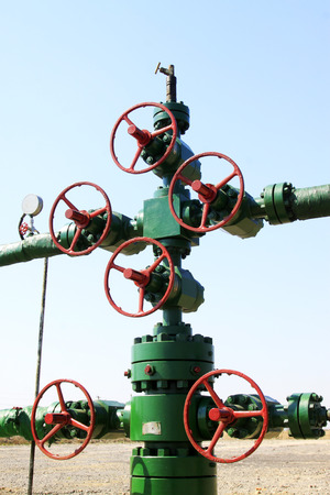 green petroleum machinery and red handwheel, closeup of photoの写真素材